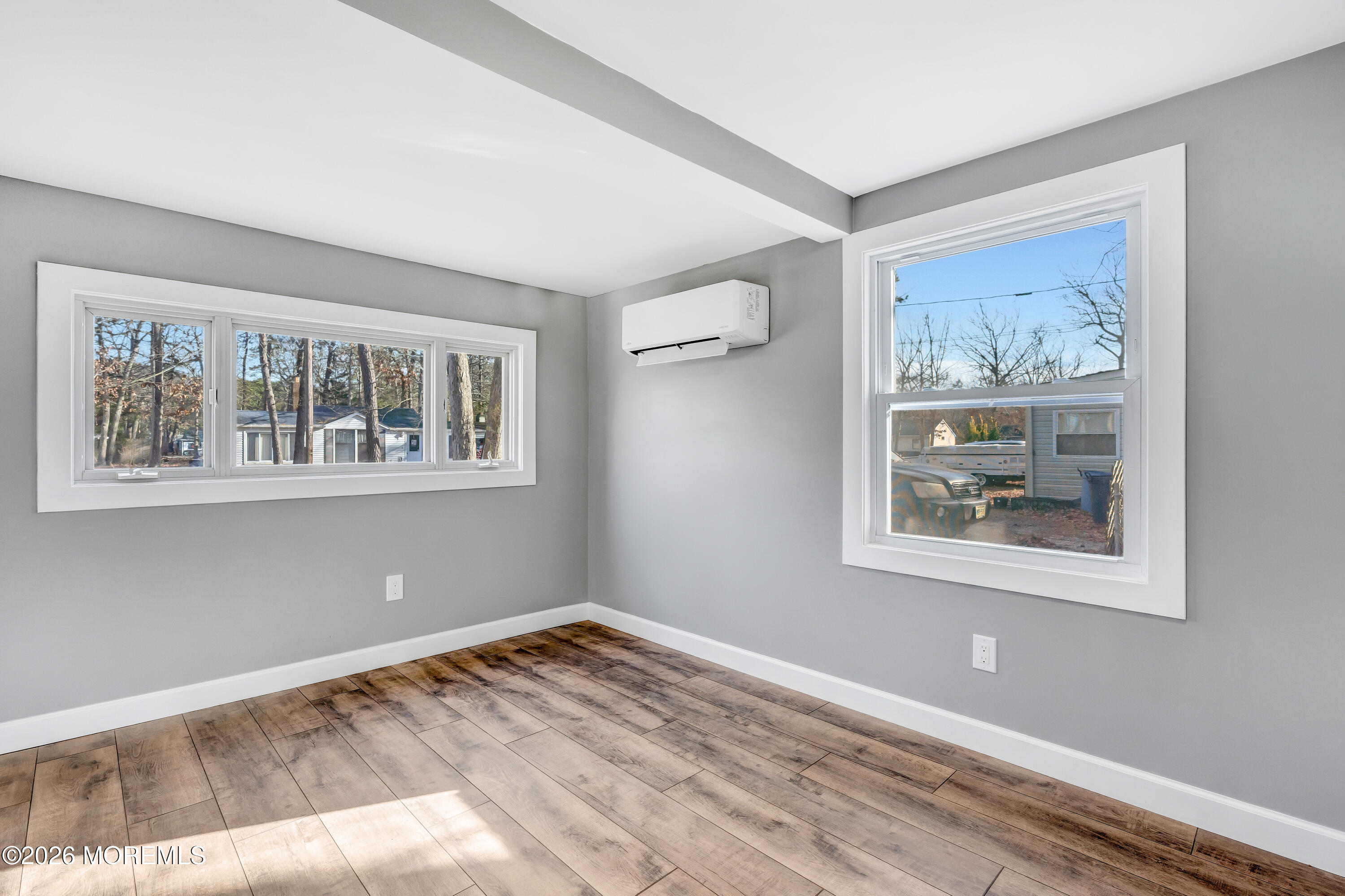 32 Chestnut Street Waretown, NJ 08758 - Photo 25 of 35 a view of empty room with window and wooden floor