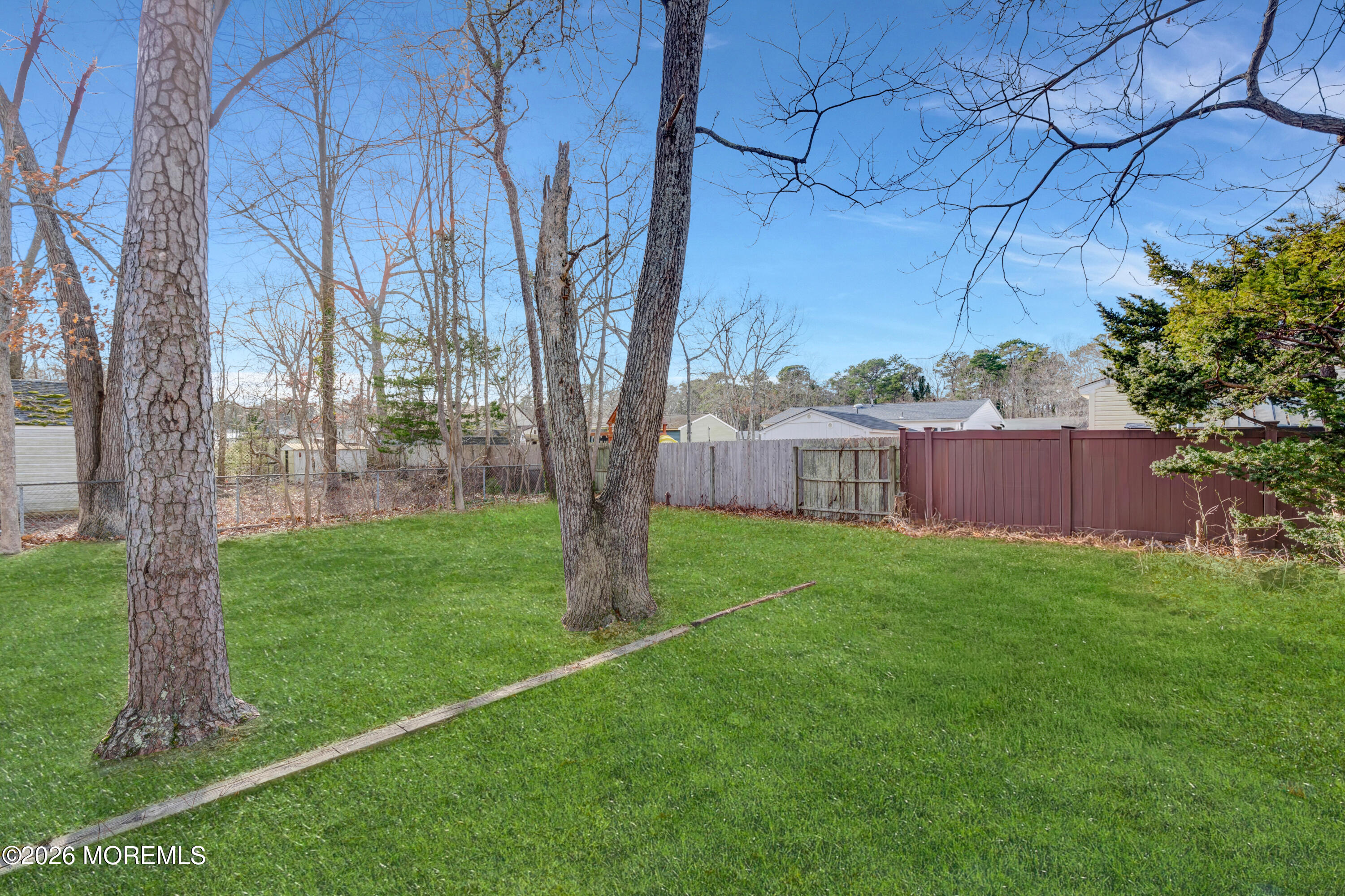 32 Chestnut Street Waretown, NJ 08758 - Photo 30 of 35 a view of a garden with a tree