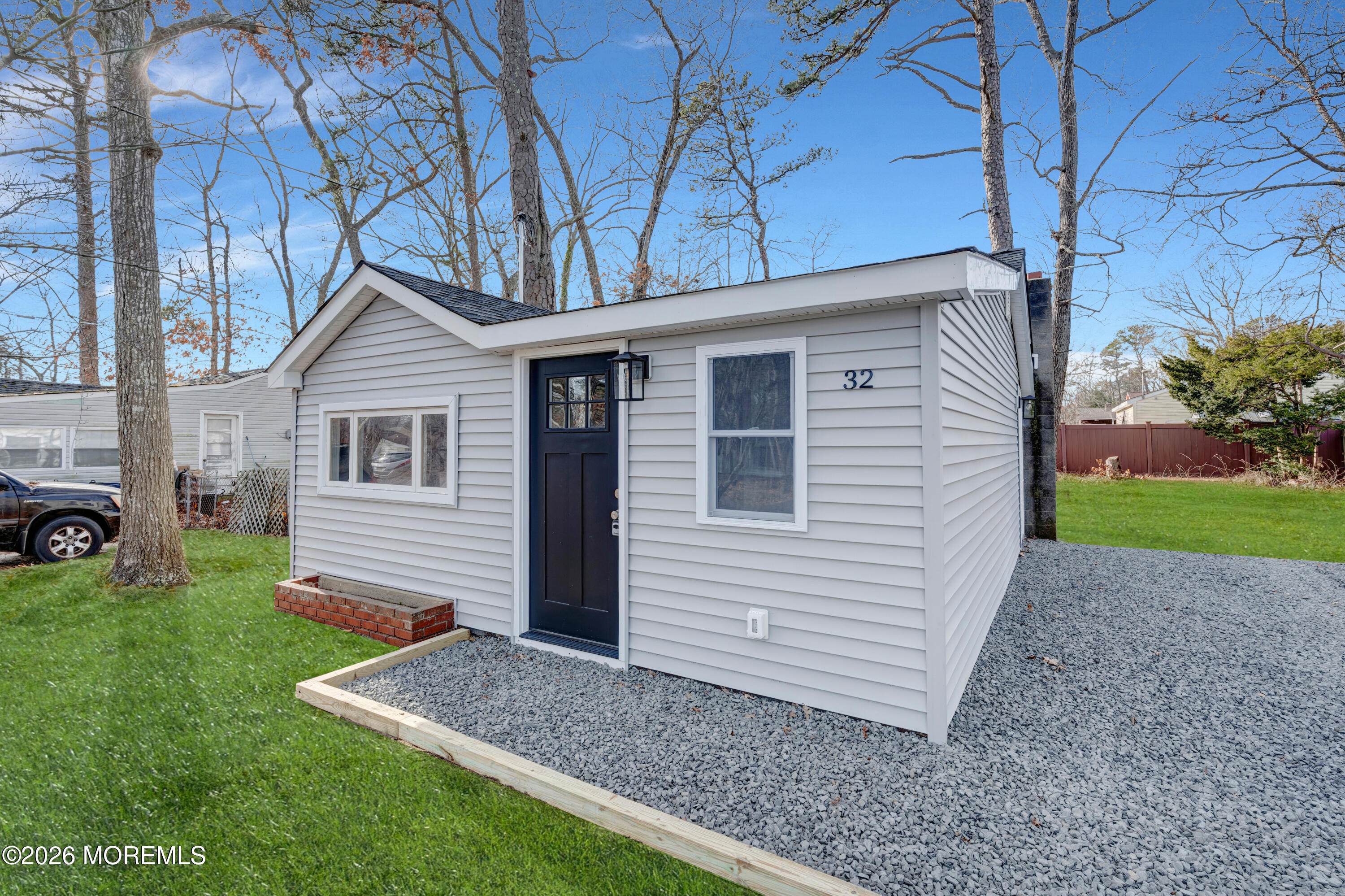 32 Chestnut Street Waretown, NJ 08758 - Photo 3 of 35 a front view of house with yard and green space