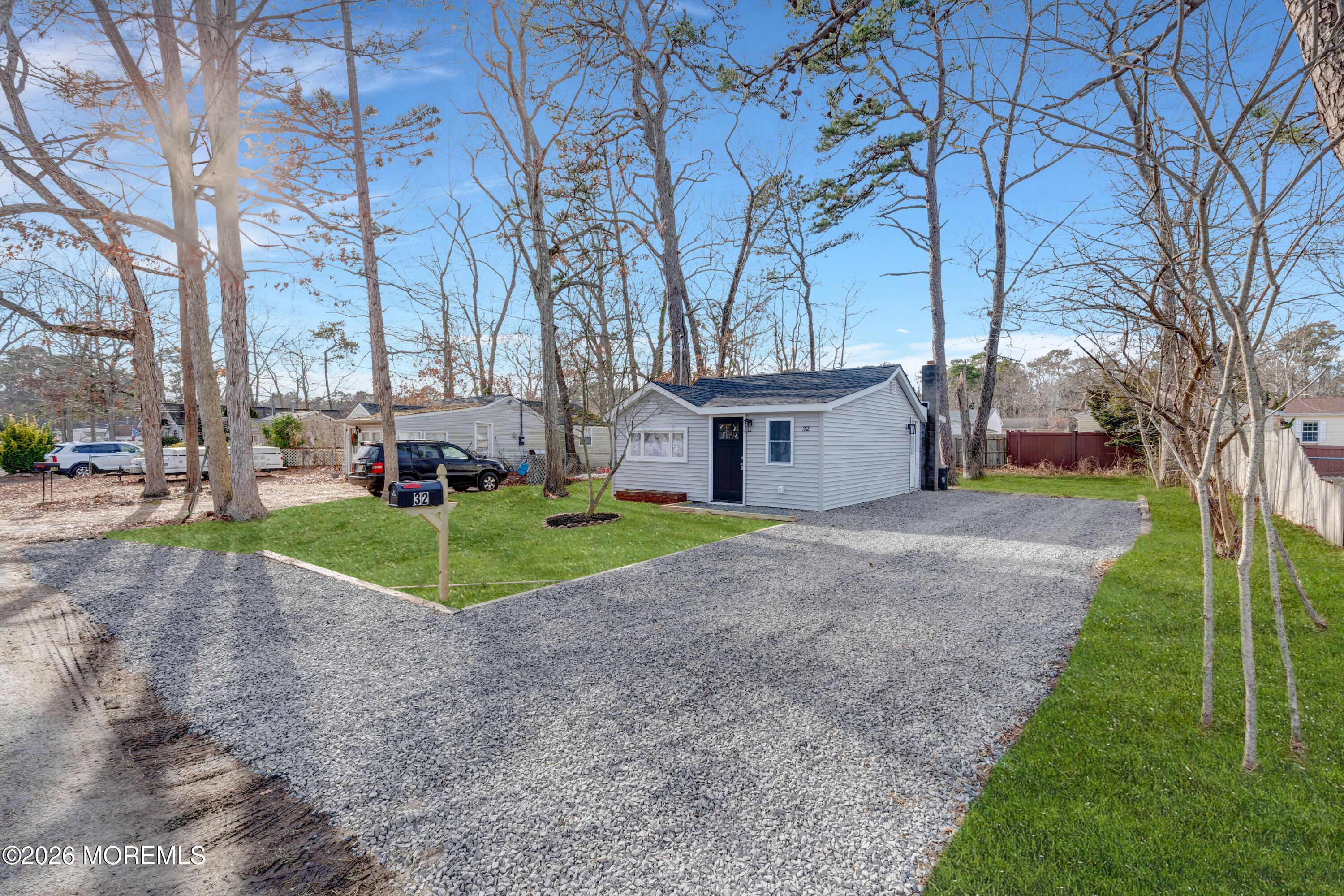 32 Chestnut Street Waretown, NJ 08758 - Photo 32 of 35 a view of a house with a yard and large trees