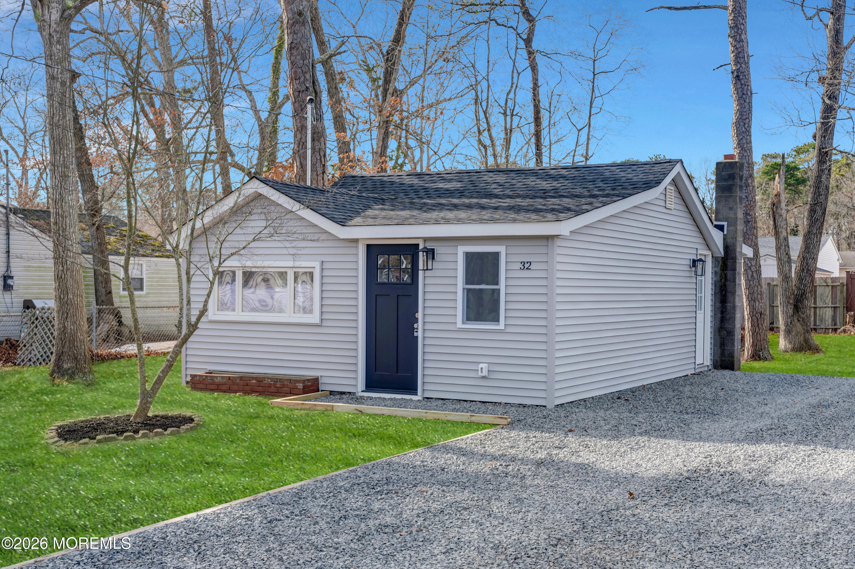 32 Chestnut Street Waretown, NJ 08758 - Photo 33 of 35 a front view of a house with a yard