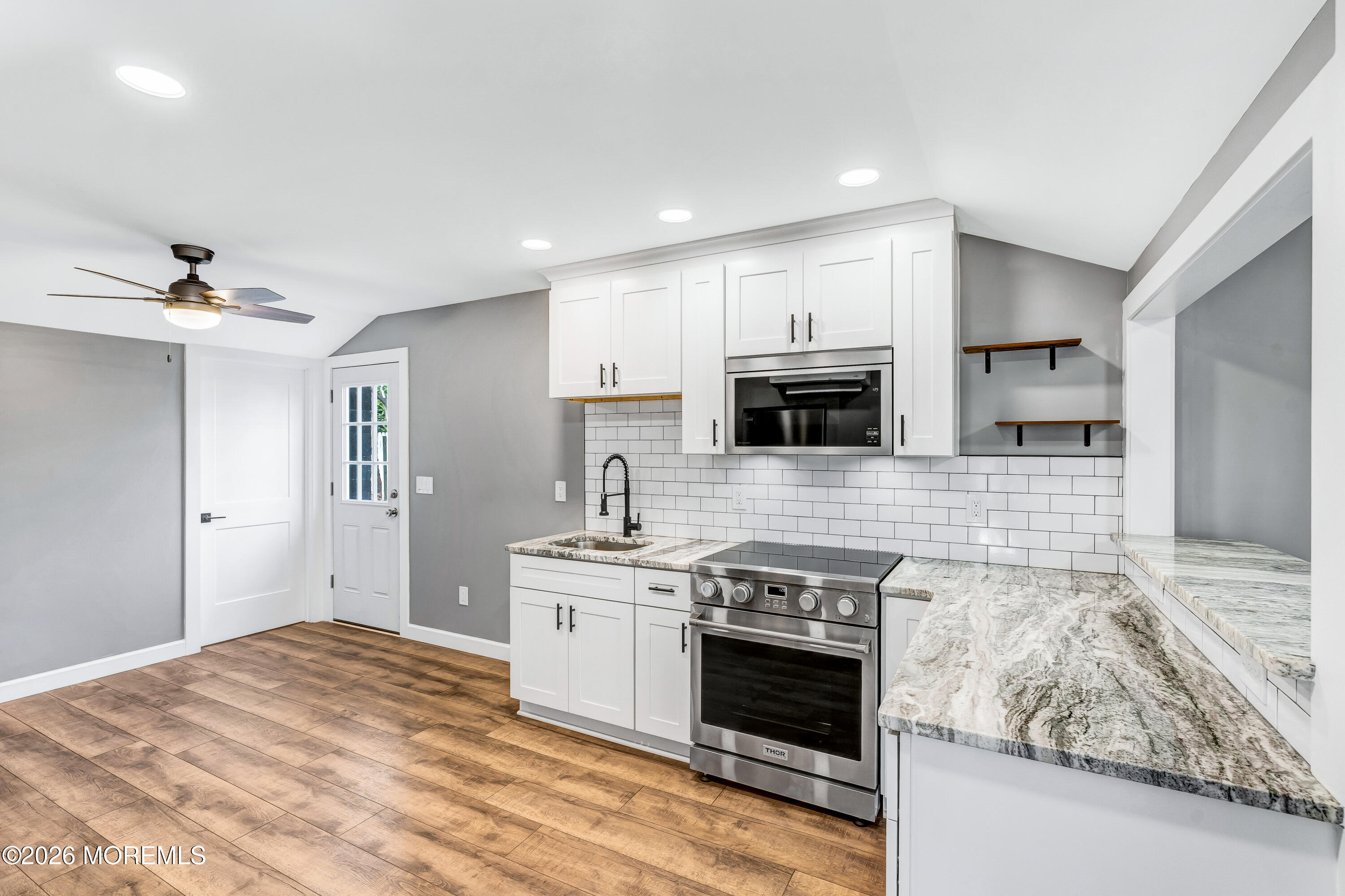 32 Chestnut Street Waretown, NJ 08758 - Photo 9 of 35 a kitchen with stainless steel appliances granite countertop a stove sink and cabinets