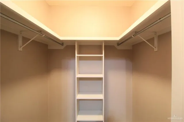 a view of an empty walk in closet