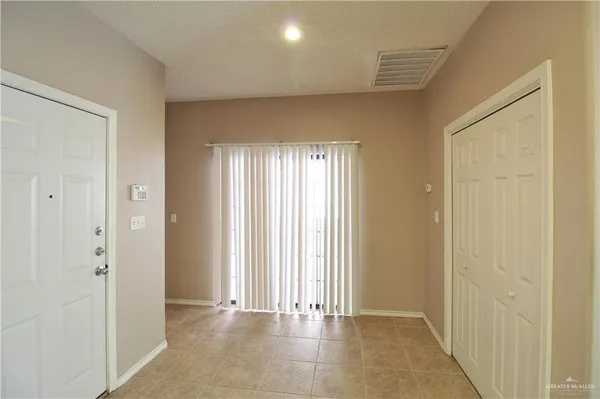 a view of an empty room and window
