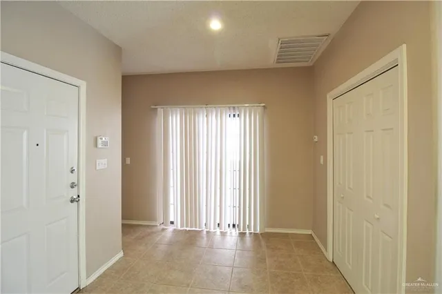 a view of an empty room and window