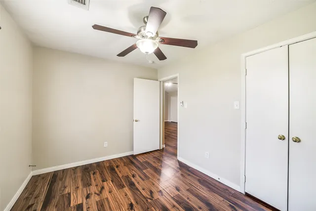 a view of an entryway with wooden floor