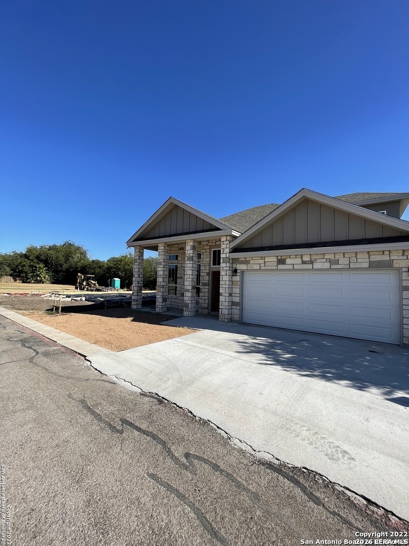 107 Sutton Place Uvalde, TX 78801 - Photo 2 of 11 a view of multiple houses with a swimming pool