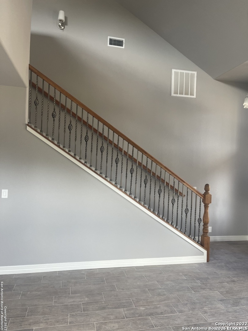 107 Sutton Place Uvalde, TX 78801 - Photo 6 of 11 a view of staircase with wooden floor