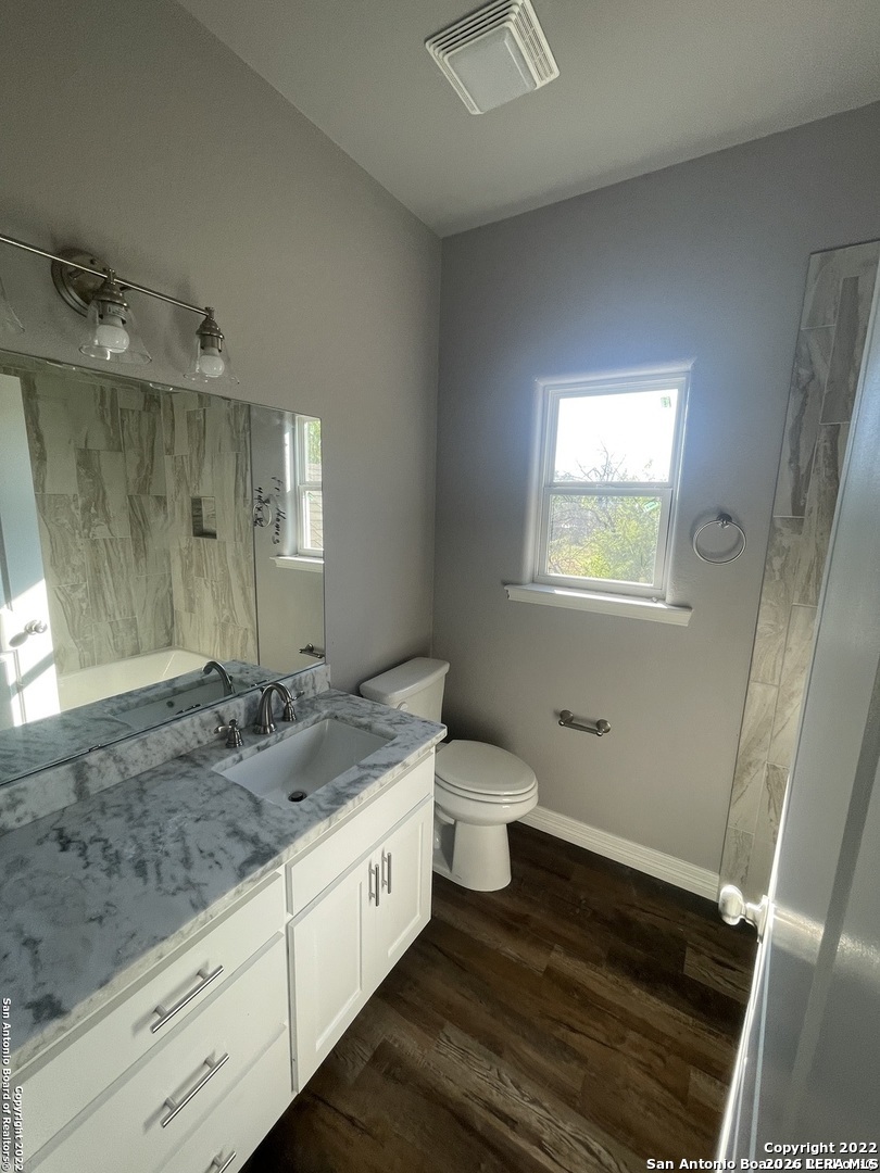 107 Sutton Place Uvalde, TX 78801 - Photo 10 of 11 a spacious bathroom with a granite countertop sink and a mirror