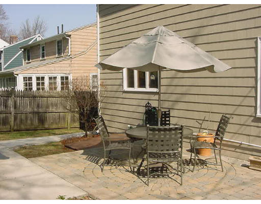 2 Florence Road Waltham, MA 02453 - Photo 12 of 13 a view of backyard with a chair and table in the patio