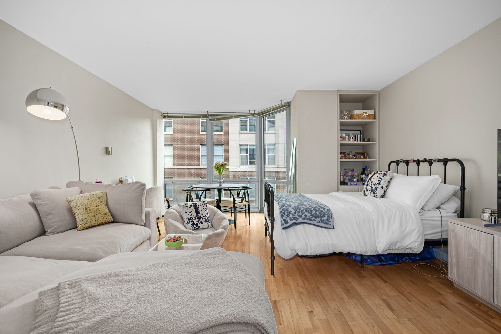 21 West Goethe Street, Unit 16E Chicago, IL 60610 - Photo 3 of 14 a living room with furniture and a large window