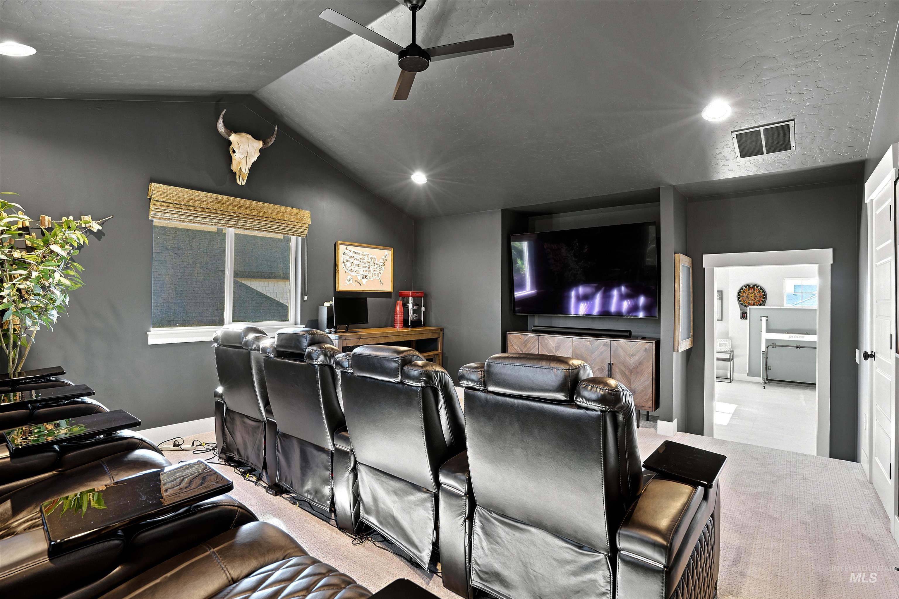 4323 West Ladle Rpds Drive Meridian, ID 83646 - Photo 25 of 49 Dedicated media room with vaulted ceilings, recessed lighting, a modern ceiling fan, and a built-in entertainment center
