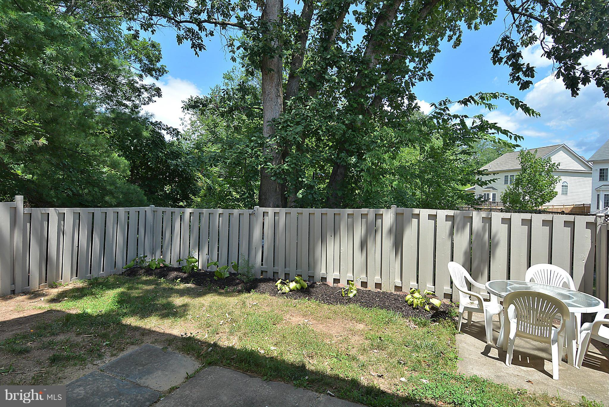 371 Reneau Way Herndon, VA 20170 - Photo 25 of 30 a view of a chair and fire pit in the backyard