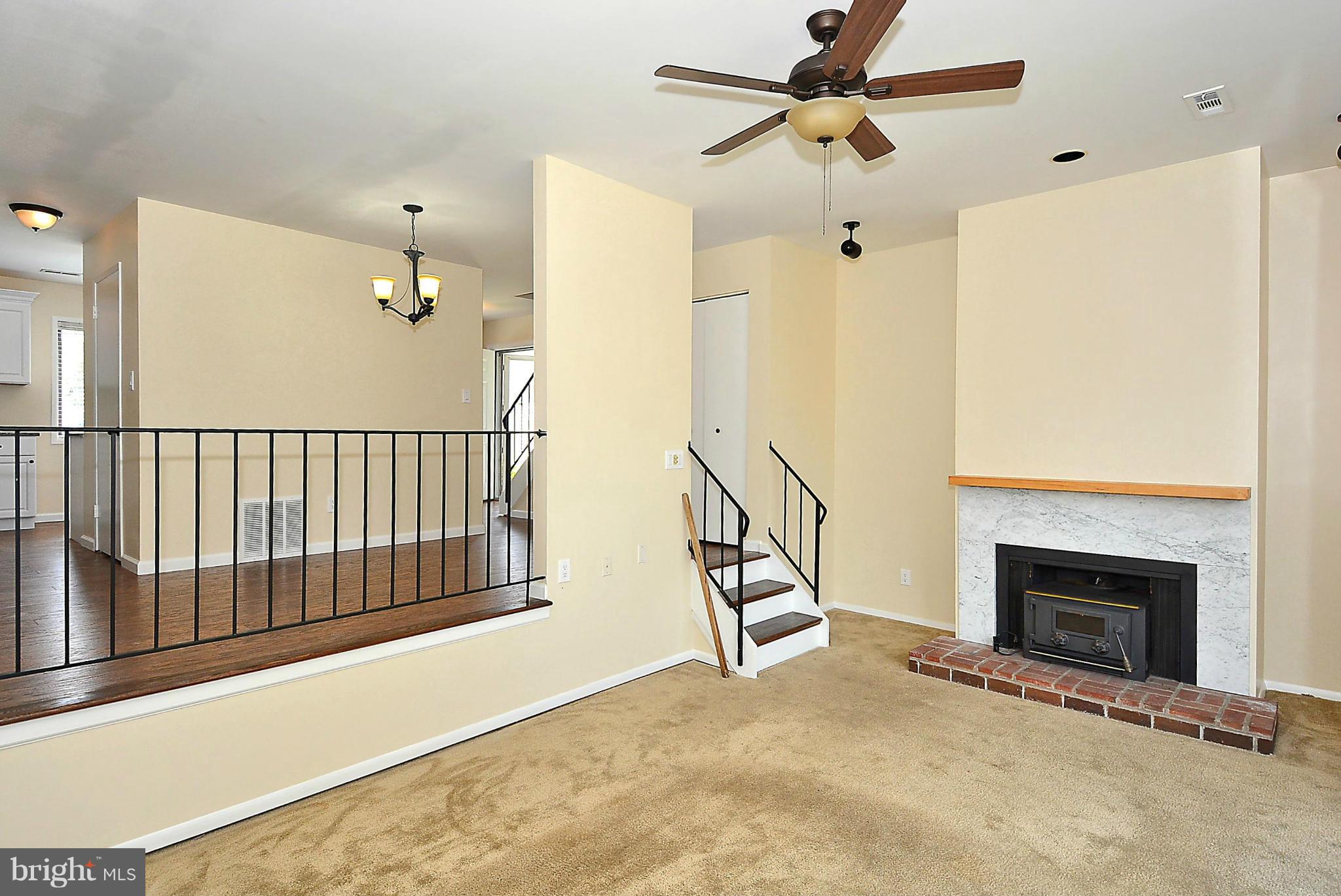 371 Reneau Way Herndon, VA 20170 - Photo 10 of 30 a view of an empty room with a fireplace