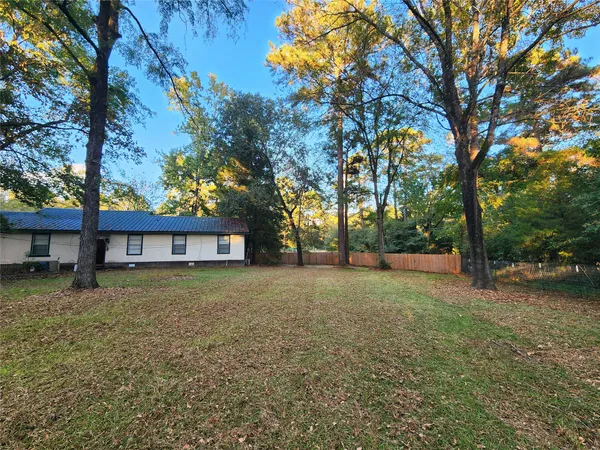 a house with trees in front of it