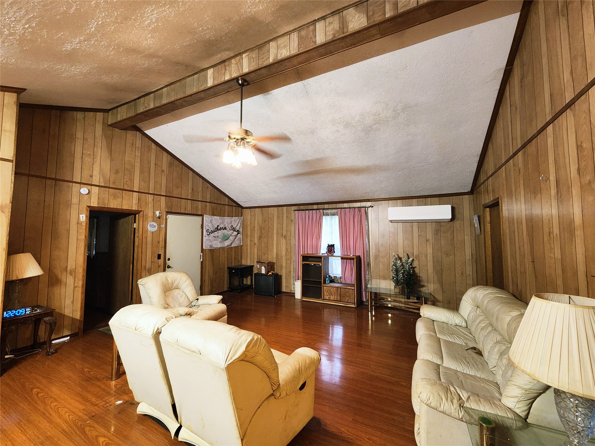 125 Hunters Drive Trinity, TX 75862 - Photo 6 of 10 a living room with furniture kitchen view and a wooden floor
