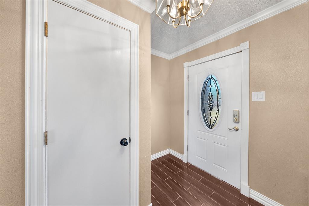 1075 Oak Ridge Drive Terrell, TX 75160 - Photo 19 of 28 a view of a hallway with wooden floor