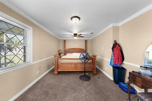 a bedroom with furniture and a window
