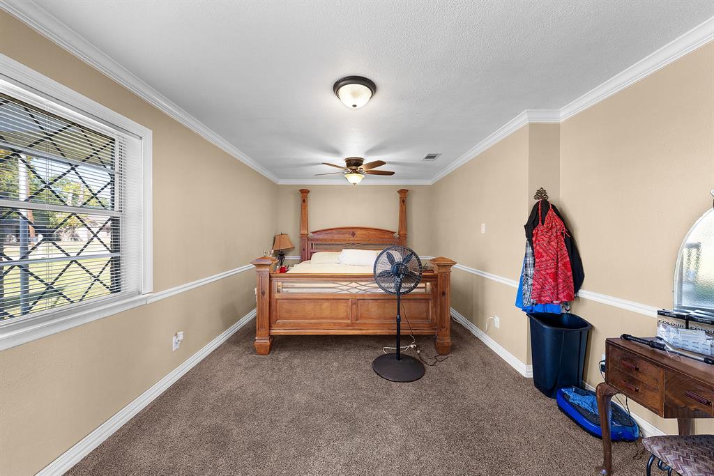 1075 Oak Ridge Drive Terrell, TX 75160 - Photo 21 of 28 a bedroom with furniture and a window