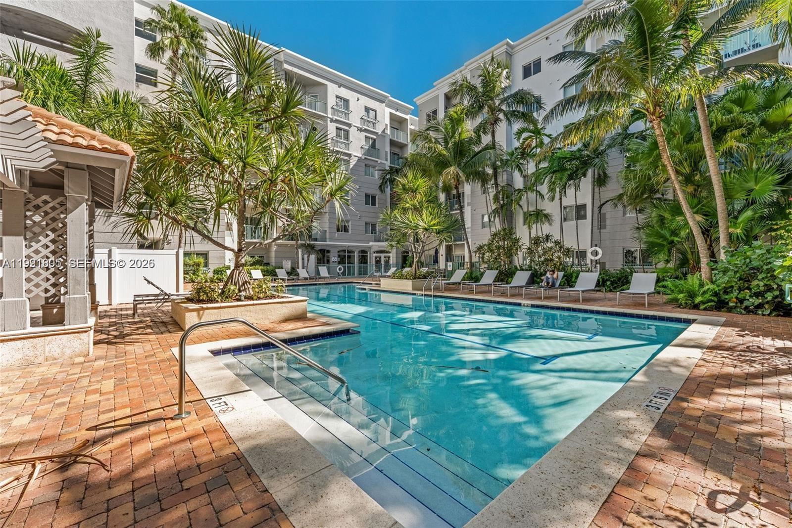 a view of a swimming pool with a patio