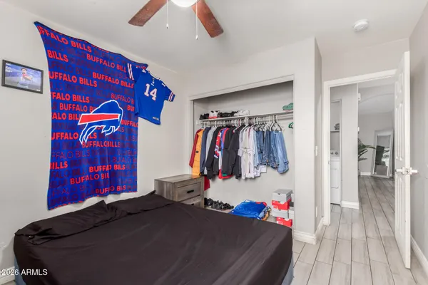 a bed room with a bed and a walk in closet