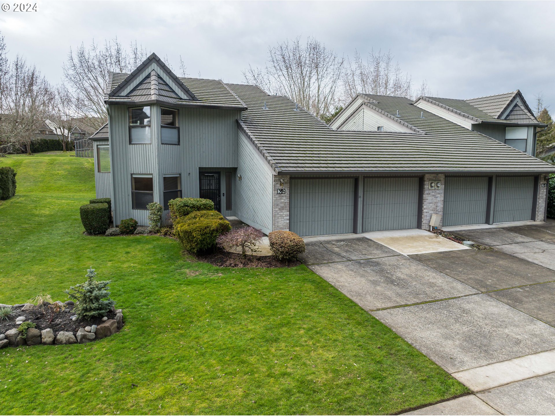 3300 Northeast 164th Street, Unit K2 Ridgefield, WA 98642 - Photo 1 of 40 a house view with a garden space