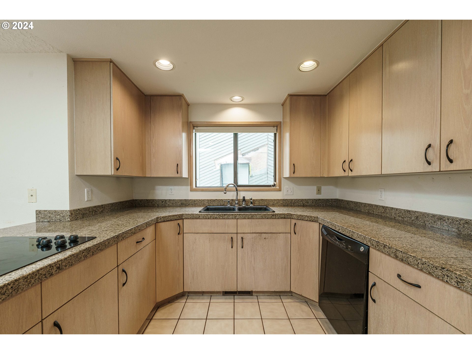 3300 Northeast 164th Street, Unit K2 Ridgefield, WA 98642 - Photo 13 of 40 a kitchen with a sink stove and cabinets