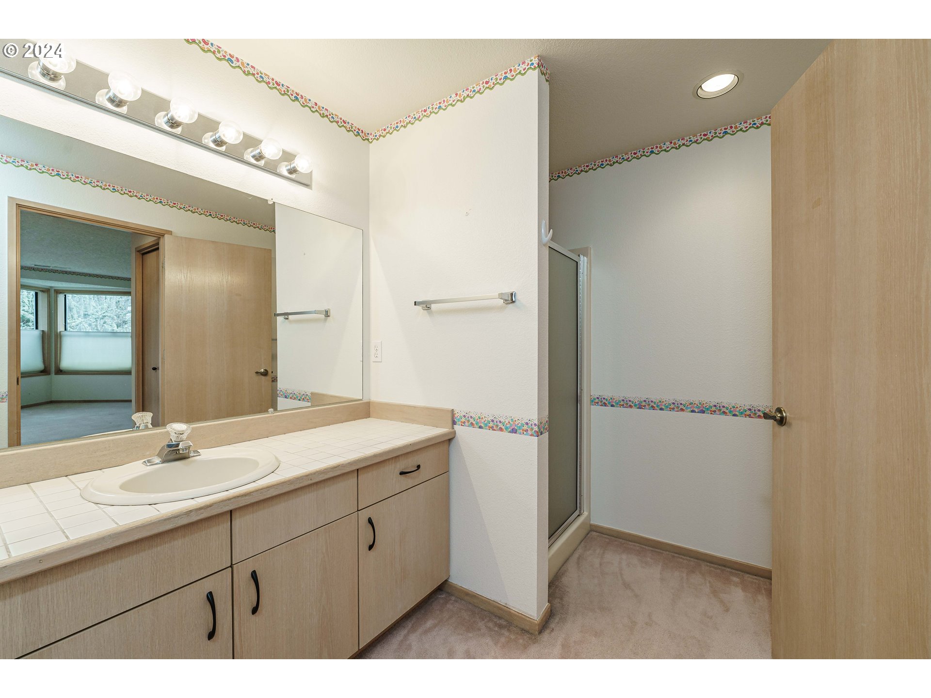 3300 Northeast 164th Street, Unit K2 Ridgefield, WA 98642 - Photo 33 of 40 a bathroom with a sink double vanity and a mirror