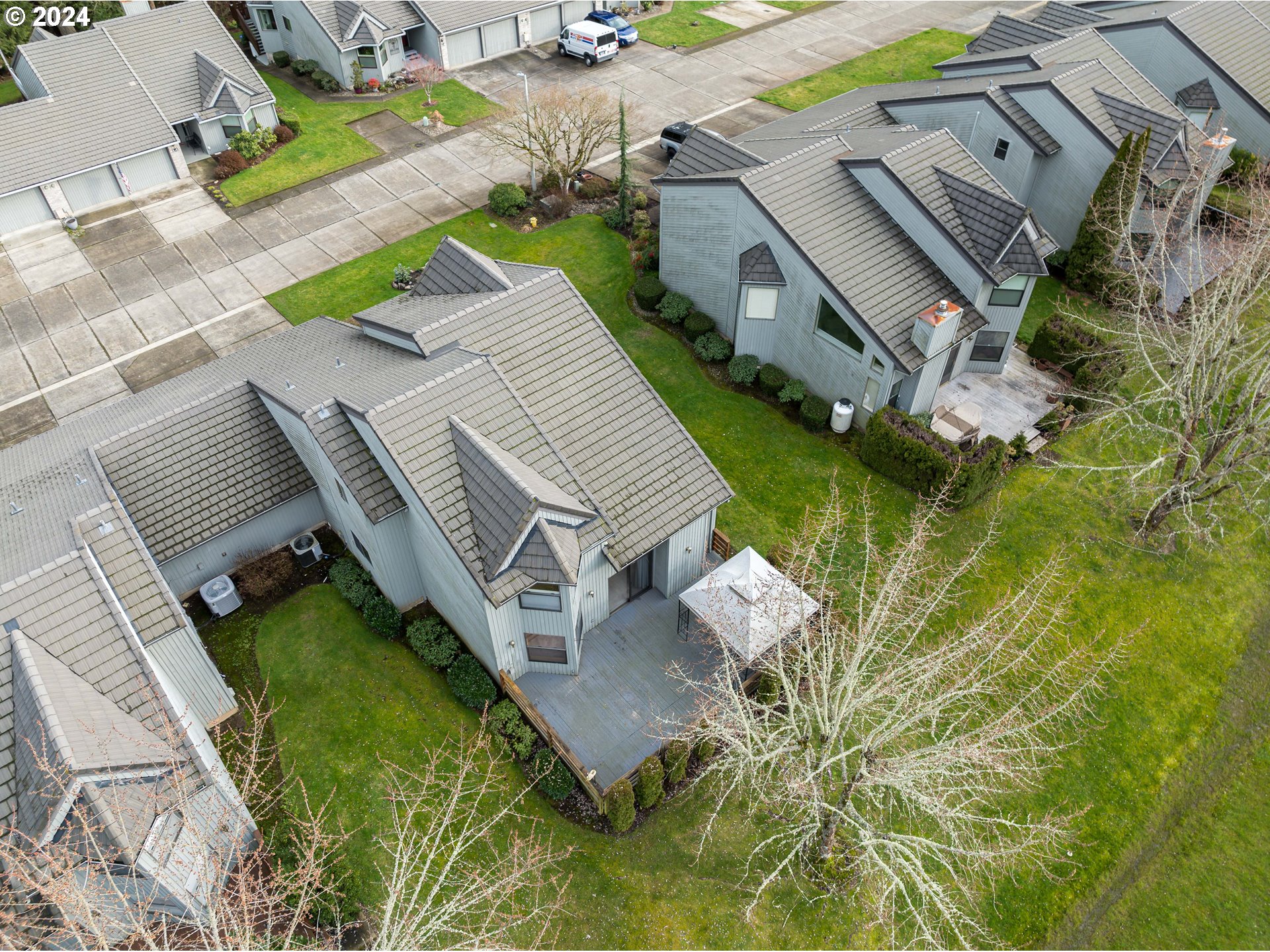 3300 Northeast 164th Street, Unit K2 Ridgefield, WA 98642 - Photo 35 of 40 an aerial view of a house with a garden and swimming pool