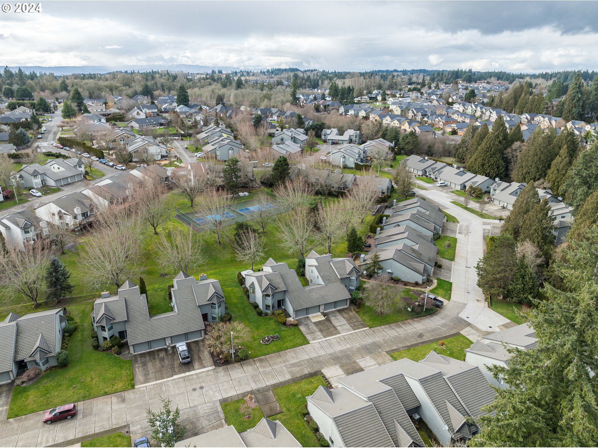 3300 Northeast 164th Street, Unit K2 Ridgefield, WA 98642 - Photo 36 of 40 an aerial view of a house with lots of trees