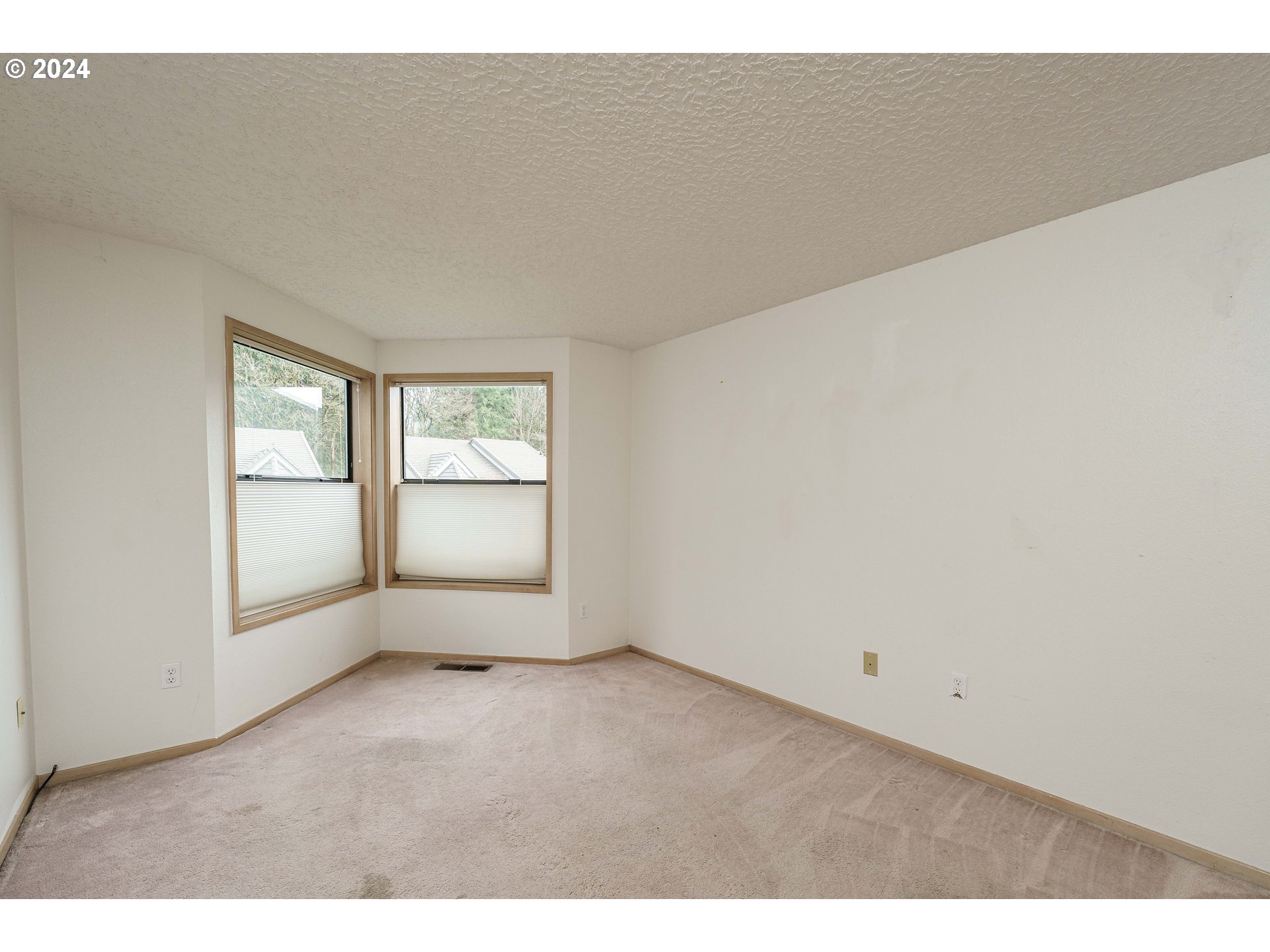 3300 Northeast 164th Street, Unit K2 Ridgefield, WA 98642 - Photo 5 of 40 an empty room with windows