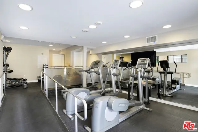 a very nice looking room with lots of gym equipment