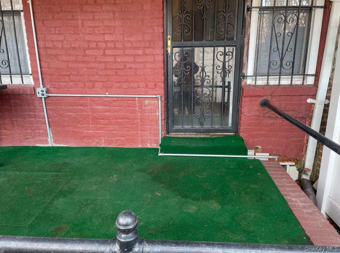 114-25 201st Street Queens, NY 11412 - Photo 17 of 18 Entrance to property with brick siding