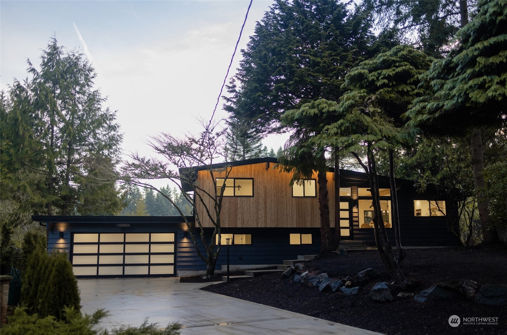 a view of a house with a tree