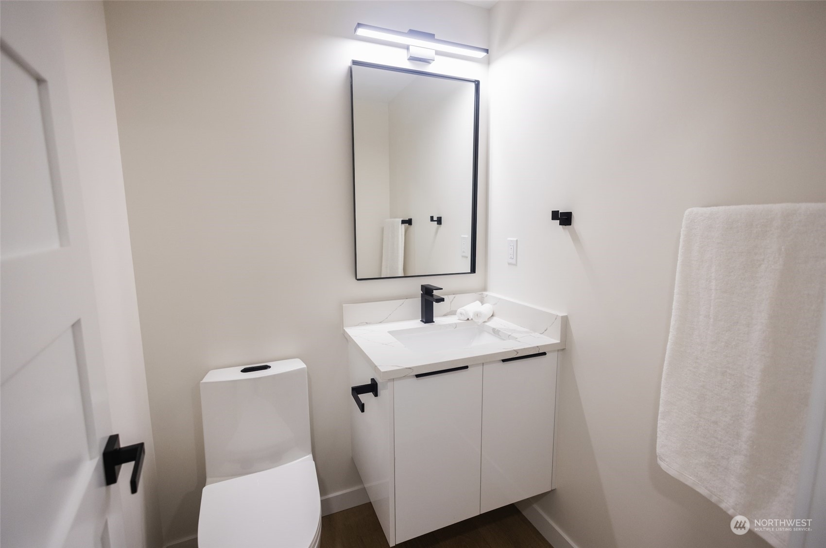 19911 82nd Place West Edmonds, WA 98026 - Photo 11 of 21 a bathroom with a toilet a sink and mirror
