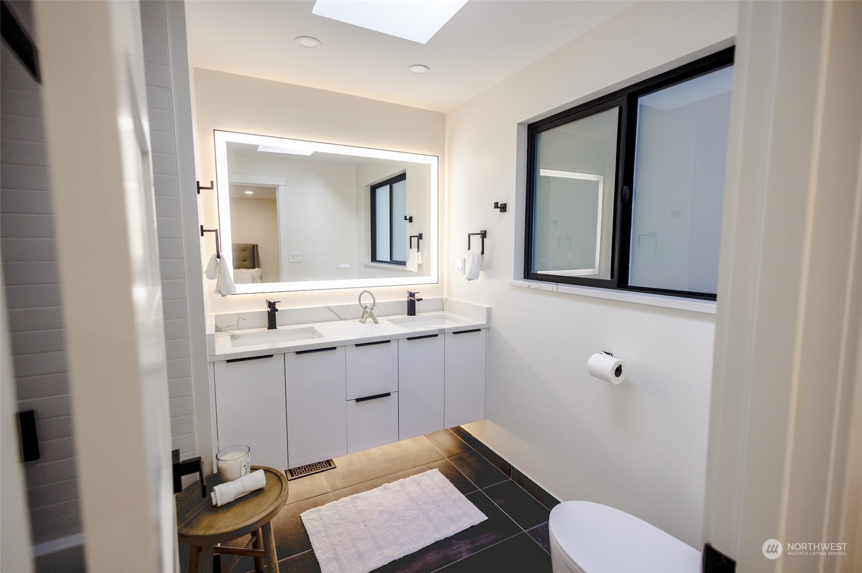 19911 82nd Place West Edmonds, WA 98026 - Photo 13 of 21 a bathroom with a sink a toilet and mirror