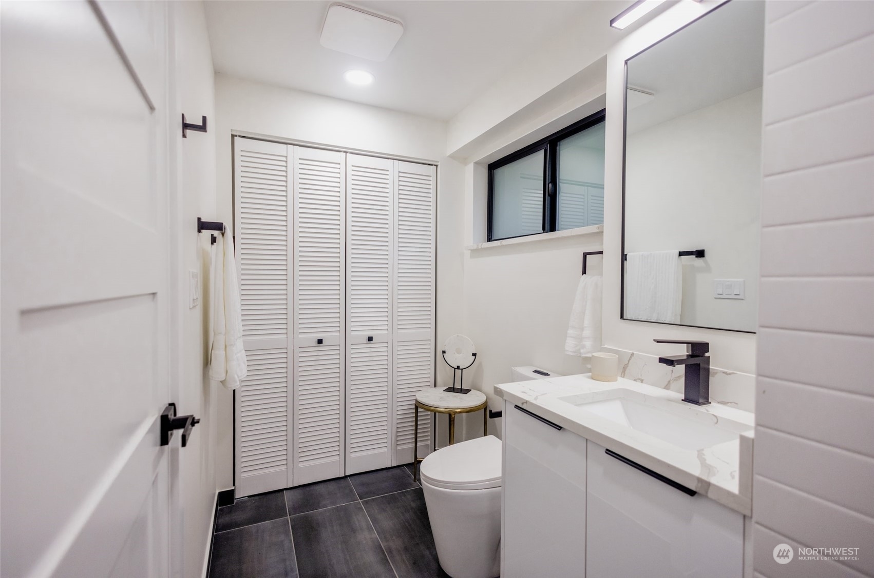 19911 82nd Place West Edmonds, WA 98026 - Photo 18 of 21 a bathroom with a sink a toilet and shower