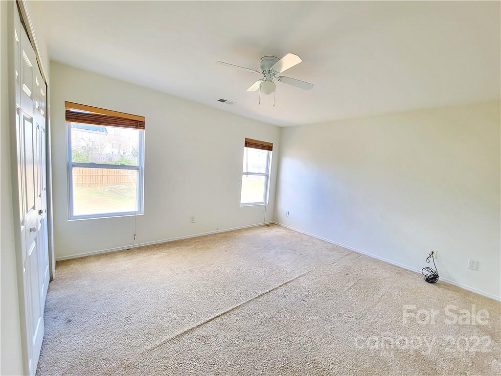 4724 Meadowfield Road Charlotte, NC 28215 - Photo 19 of 29 a view of an empty room with a window