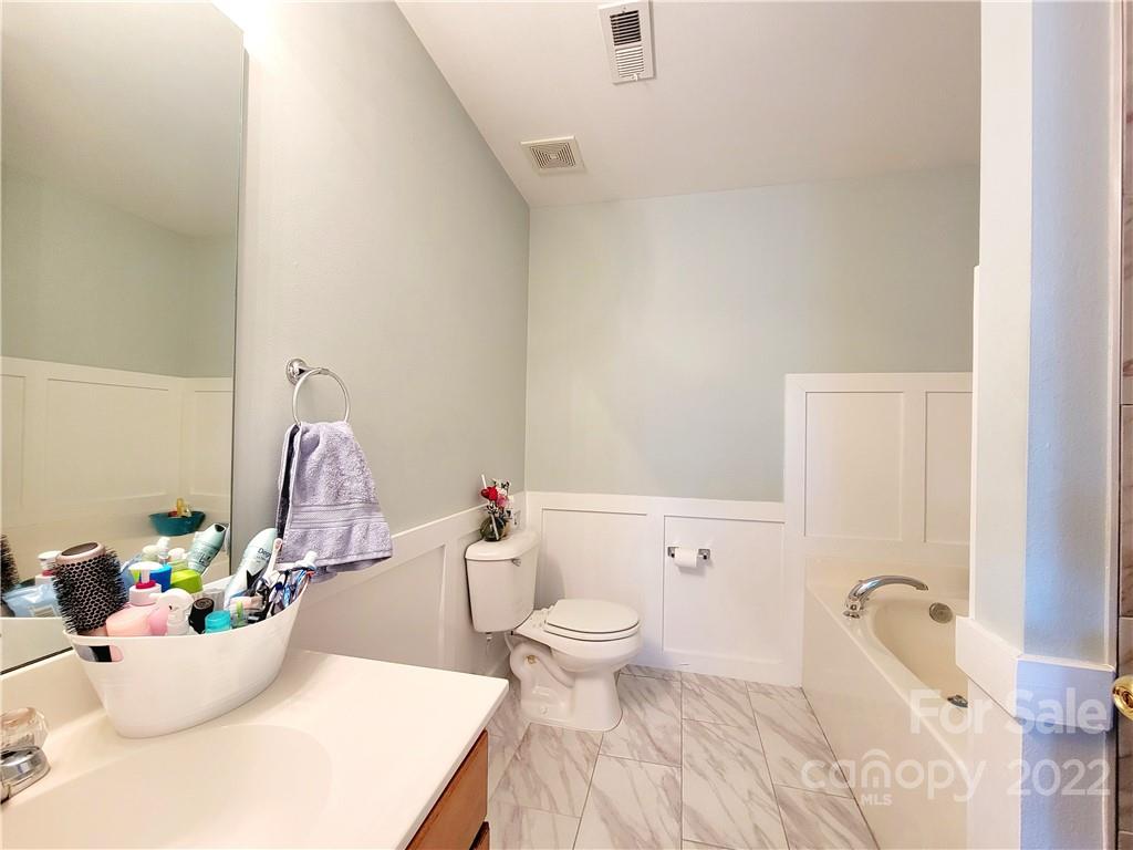4724 Meadowfield Road Charlotte, NC 28215 - Photo 25 of 29 a bathroom with a sink toilet and shower