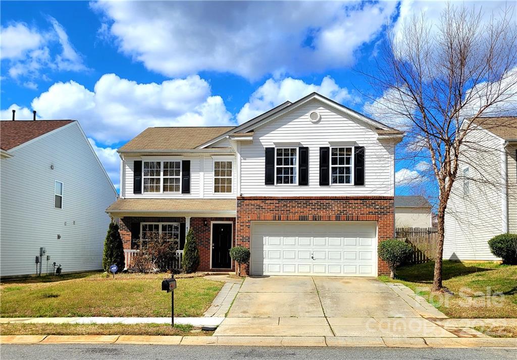 4724 Meadowfield Road Charlotte, NC 28215 - Photo 5 of 29 a front view of a house with a yard