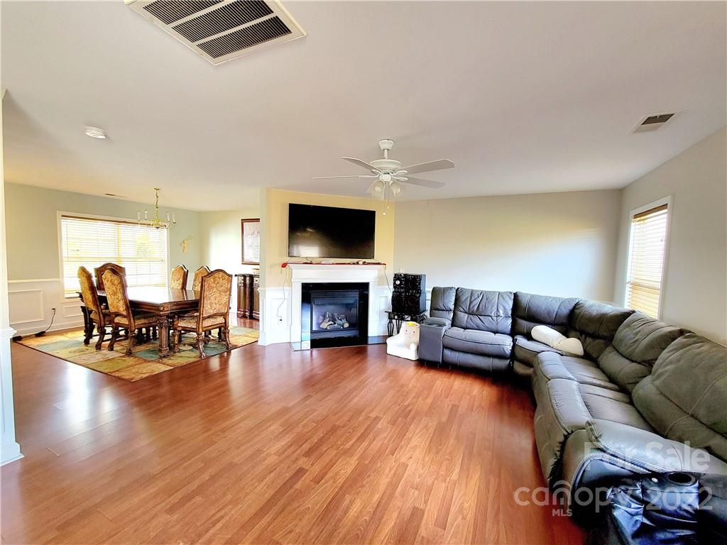 4724 Meadowfield Road Charlotte, NC 28215 - Photo 7 of 29 a living room with furniture and a fireplace