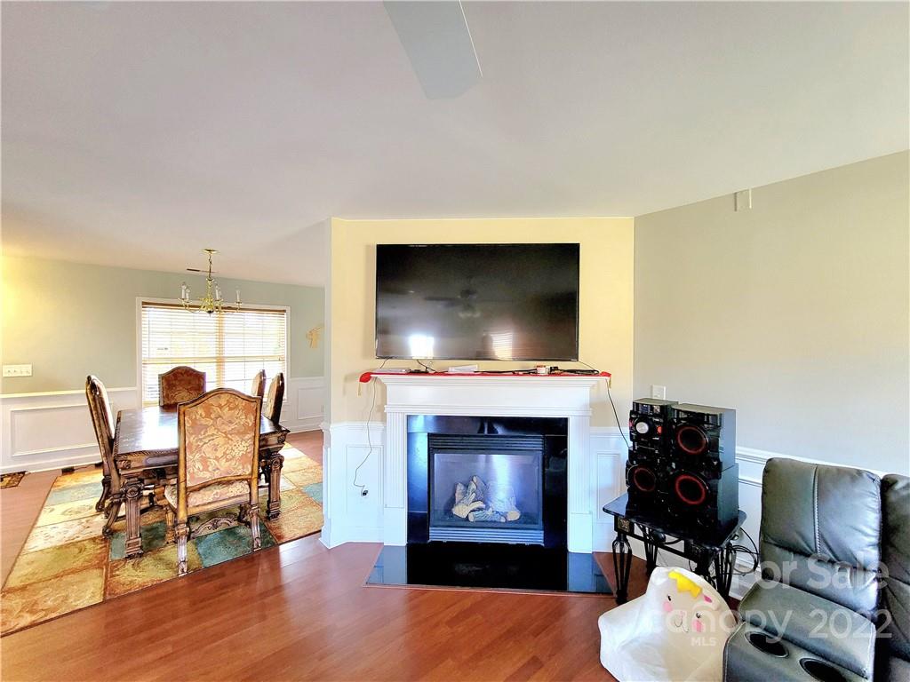 4724 Meadowfield Road Charlotte, NC 28215 - Photo 8 of 29 a living room with furniture and a fireplace
