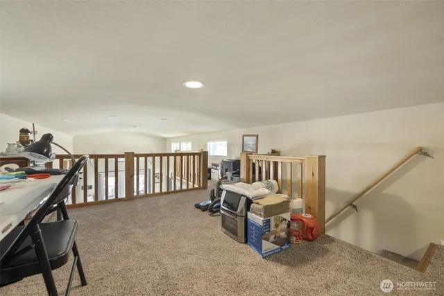 a living room with furniture and a chair