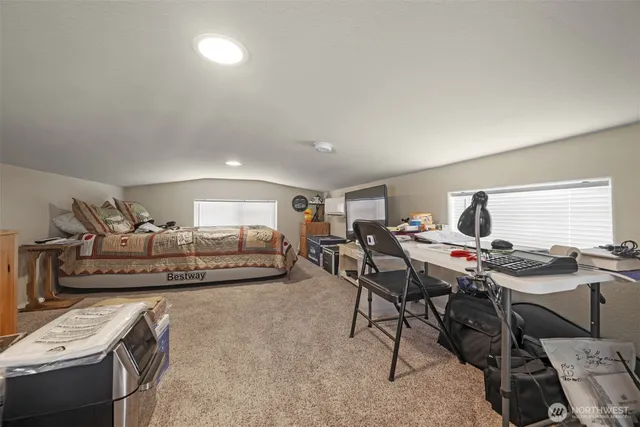 a view of an room with wooden floor and windows