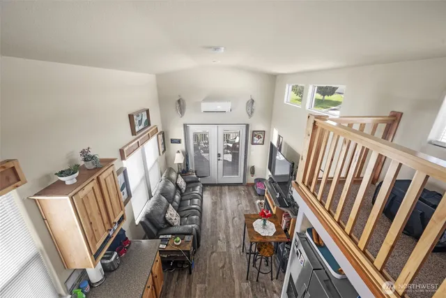 a view of an livingroom with furniture and staircase