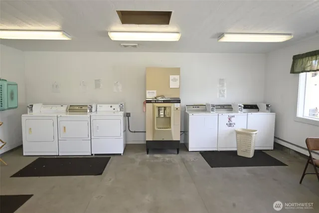 swimming pool view with a seating space