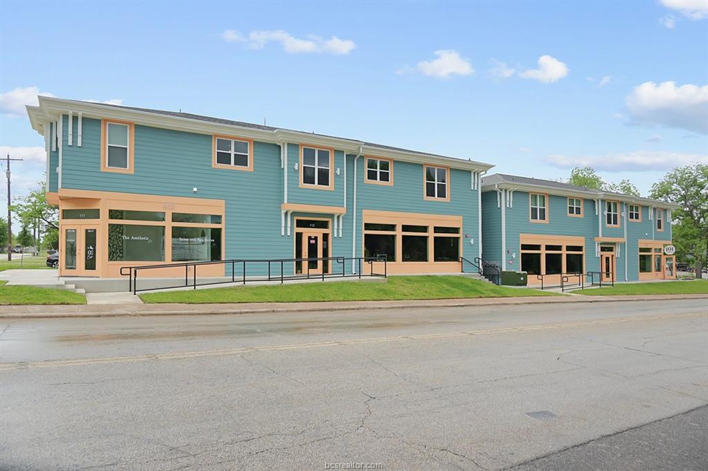 603 South Sims Avenue, Unit 113 Bryan, TX 77803 - Photo 1 of 10 front view of a brick building next to a yard