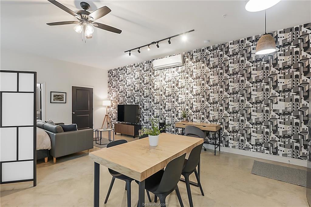 603 South Sims Avenue, Unit 113 Bryan, TX 77803 - Photo 7 of 10 a view of a dining room with furniture and a chandelier fan