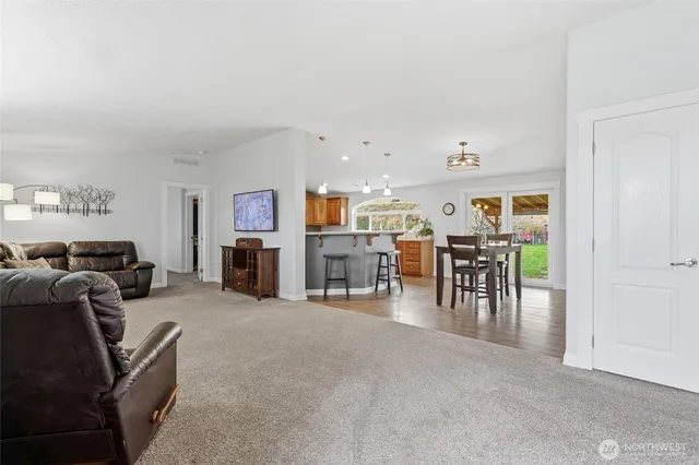 a living room with furniture and a table