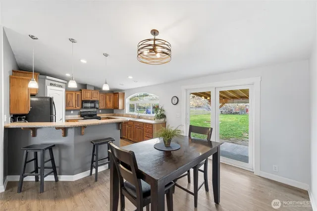 a view of a dining room with furniture window and wooden floor